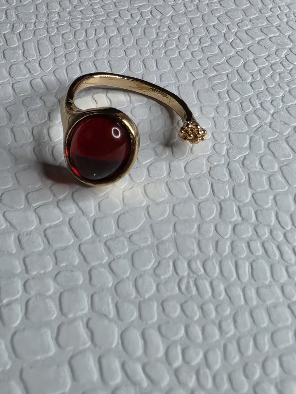 Gold-Tone Ring with Deep Red Cabochon and Accent Stone